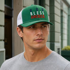 Model wearing God Bless America mid profile trucker hat