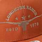 Longhorn Ranch mid profile trucker hat in orange and khaki, side view