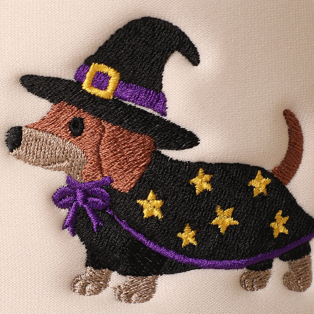 Witch dachshund embroidered foam trucker hat in tan, angled view