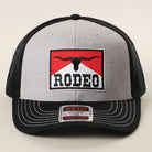 Rodeo patch mid profile trucker hat in black and heather grey