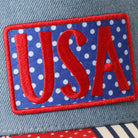 USA embroidered patch denim trucker hat, side view