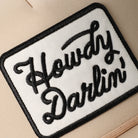 Howdy Darlin' patch checker foam trucker hat in khaki, side view