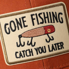 Gone Fishing Catch You Later patch trucker hat in orange and khaki, side view