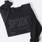 Spooky Season bold puff sweatshirt in black, front view