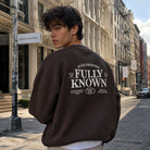 Model wearing Fully Known Psalm 139 graphic sweatshirt, back view