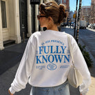 Model wearing Fully Known Psalm 139 graphic sweatshirt, back view