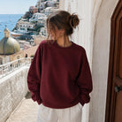 Model wearing Oyster & Champagne graphic sweatshirt, front view