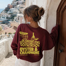 Model wearing Oyster & Champagne graphic sweatshirt