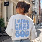 Model wearing I Am A Child Of God graphic sweatshirt