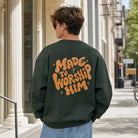 Model wearing Made To Worship Him graphic sweatshirt