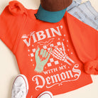Vibin' With My Demons graphic sweatshirt in orange