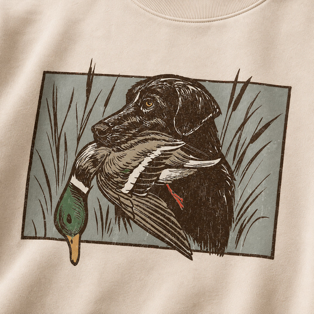 Hunting dog and duck graphic sweatshirt in sand, detail view