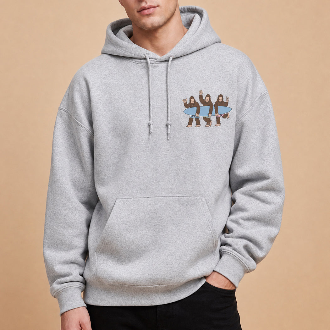 Surf Squatch Bigfoot graphic hoodie in ash grey, front view