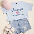 Cowboys And Tequila distressed graphic t-shirt in light blue, front view